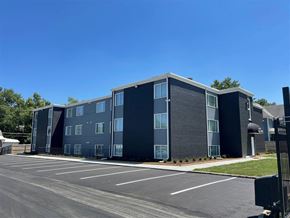 Topeka apartment for rent - a building with a parking lot