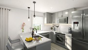 Talahassee apartment for rent - A modern kitchen with a refrigerator displaying the time.