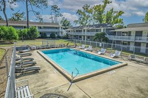 Tallahassee apartment for rent - Pool With Relaxing Chairs at The Sanctuary, Tallahassee, Florida