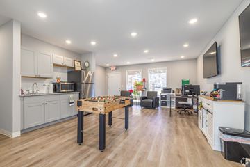 Pittsburg apartment for rent - A kitchen with a table and chairs in the middle of the room.
