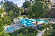 Riverside apartment for rent - A pool surrounded by trees and plants at The Aspens Riverside, Riverside, 92504