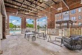 Atlanta apartment for rent - A large, empty room with a pool table and a couch.
