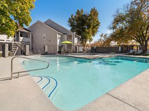 St. George apartment for rent - our apartments have a resort style pool with trees at Bella Vista, St. George, Utah