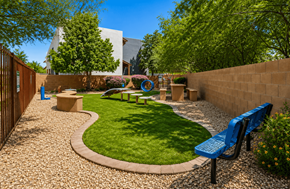 Tucson apartment for rent - A small garden with a bench and a playground.