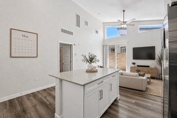 Phoenix apartment for rent - A kitchen with a calendar on the wall and a refrigerator on the right.