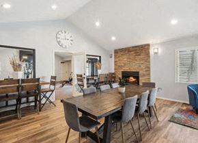 St. George apartment for rent - a dining room with a wooden table and chairs and a fireplace at Bella Vista, St. George, Utah