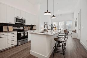 Atlanta apartment for rent - a white kitchen with a counter top and a sink at Smith and Porter, Georgia