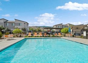 Phoenix apartment for rent - a large swimming pool with chairs around it at Baseline on 16, Phoenix, Arizona