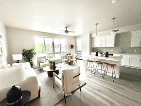 San Diego apartment for rent - A modern open plan living and kitchen area with a dining table and chairs.