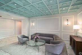 Lemont apartment for rent - a living room with gray couches and a glass coffee table