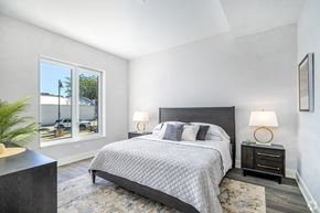 Lemont apartment for rent - a bedroom with a bed and two windows