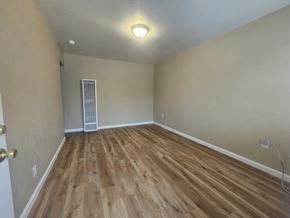 Pittsburg apartment for rent - A room with wooden flooring and a white ceiling.