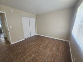 Antioch apartment for rent - A room with a wood floor and a white closet.