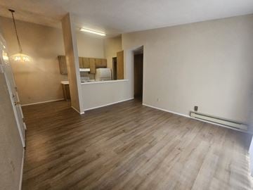 Bay Point apartment for rent - A room with wooden flooring and a mirror on the wall.