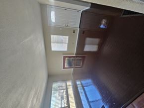 Pittsburg apartment for rent - the view from the top of a staircase looking down into a room with windows