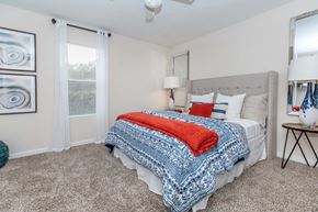 Clute townhouse for rent - Bedroom with cozy bed at Royal Wildewood Manor Apartments, Clute, Texas