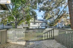 Bay Point condo for rent - a porch with a white fence and some trees