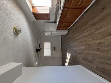 Antioch house for rent - the view of the kitchen from the dining table in the center of the living room