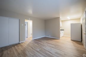 Antioch apartment for rent - A room with wooden flooring and white walls.