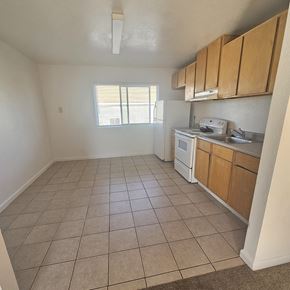 Antioch apartment for rent - A kitchen with white appliances and wooden cabinets.