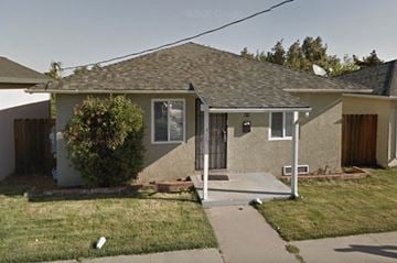 Antioch house for rent - a house with a front porch and a sidewalk