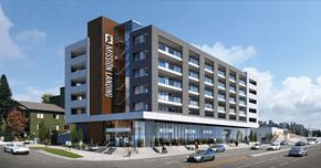 Calgary apartment for rent - a rendering of a building on the corner of a city street