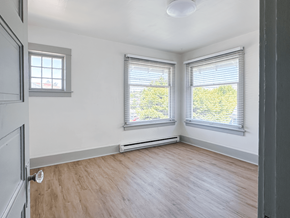 Seattle triplex for rent - A room with a window and a door.
