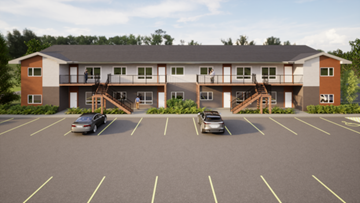 Stonewall apartment for rent - A car is parked in a parking lot in front of a two-story apartment building.