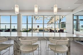 Cleveland apartment for rent - A modern dining area with marble tables and chairs.