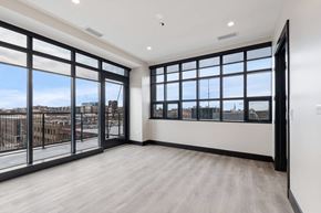 Chicago apartment for rent - the living room has windows and a view of the city