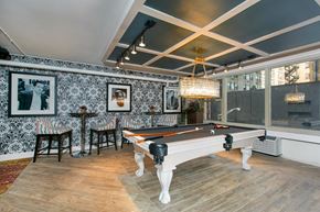 Chicago apartment for rent - the pool room has a chandelier and a view of the city