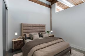 Chicago apartment for rent - a bedroom with a bed and a window