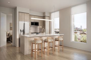 Chicago apartment for rent - A kitchen with a bar stool in front of the counter.