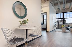 Chicago apartment for rent - A modern dining room with a white table and chairs.