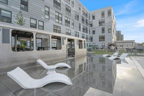 Chicago apartment for rent - a reflection of a building in a pool of water