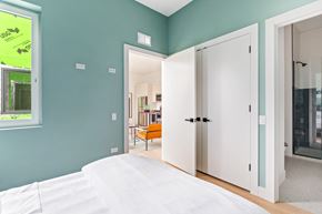 Chicago apartment for rent - A bedroom with a bed and a wardrobe.