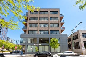 Chicago apartment for rent - A modern building with the word "PEACHY" on the front.