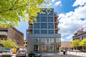 Chicago apartment for rent - A modern building with the word "Peachy" on the front.