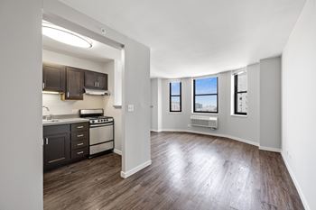 Renovated studio with separate kitchen and wood flooring