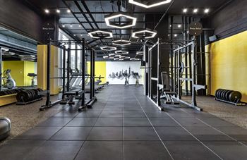 Full gym with peloton bikes