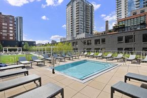 Chicago apartment for rent - Rooftop pool deck with lounge chairs and city views at River North Park Apartments, Chicago, IL