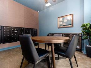 Chicago apartment for rent - A conference room with a wooden table and two chairs.