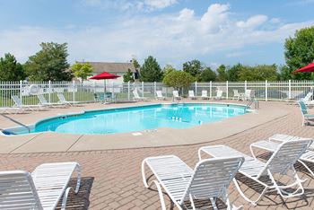 Webster woods' resort-style swimming pool & pool deck for relaxing