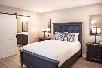 Primary bedroom with ensuite bathroom with step-in shower and walk-in closet