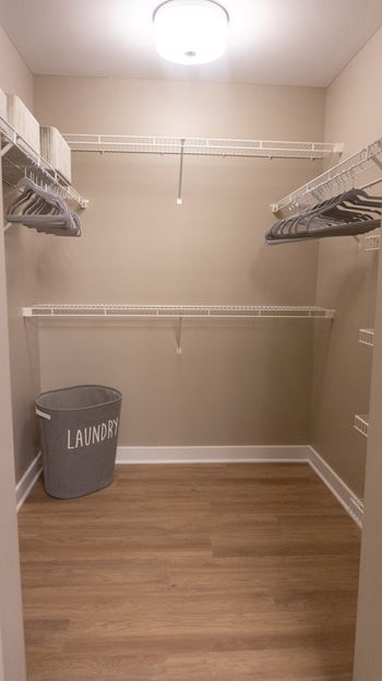 Primary bedroom walk-in closet