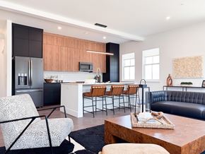 Pittsford apartment for rent - A modern kitchen with a black and white chair.