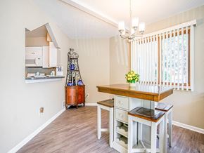 Rochester townhouse for rent - a kitchen with a table and a counter top