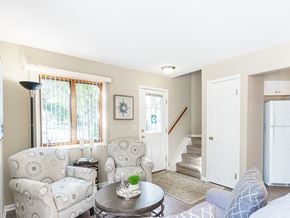 Rochester townhouse for rent - a living room with two chairs and a table