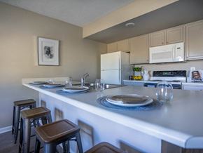 Webster townhouse for rent - Kitchen area of great room with breakfast bar & bar stools