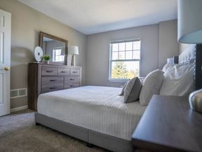 Webster townhouse for rent - Interior view of carpeted bedroom with entrance to bathroom